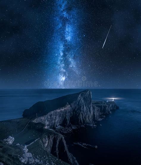 Neist Point Lighthouse And Stars In Isle Of Skye Scotland Stock Photo