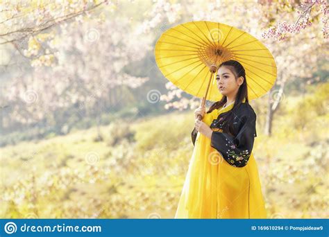 Korean Girl Wearing A Hanbok Wearing A Yellow Umbrella. Beautiful Female Wearing Traditional ...