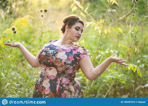 Plus Size Fashion Model In Floral Dress Outdoors Beautiful Fat Woman