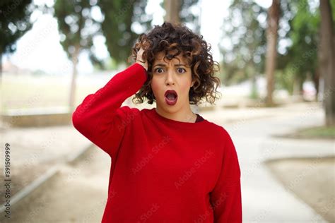 Embarrassed Attractive Babe Beautiful Arab Woman Standing Outdoors Wearing Red Sweater With