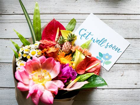 Whether the condition is mild and temporary or something more serious, get well wishes can boost the spirits of. Get Well Soon Message With Bouquet Stock Photo - Download ...