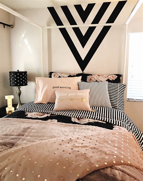 Nebulosity provides a daring dive into an endless black abyss. Girls room. Black, gold and pink. Black paint feature wall. Black and white stripes. Design with ...