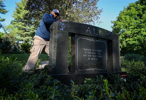 Muhammad Ali Gravesite In Louisville Collects Mementos From Fans