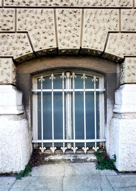 Secession Facade With Old Ruined Window With Decorative Metal Grids