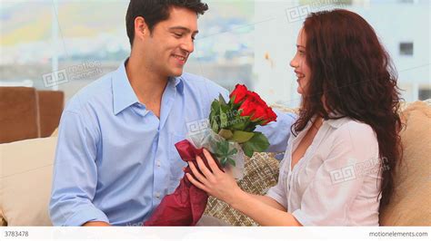 Man Bringing A Bunch Of Flowers To His Wife Stock Video Footage 3783478