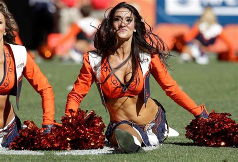 A Denver Broncos Cheerleader Does The Splits During The First Half In A