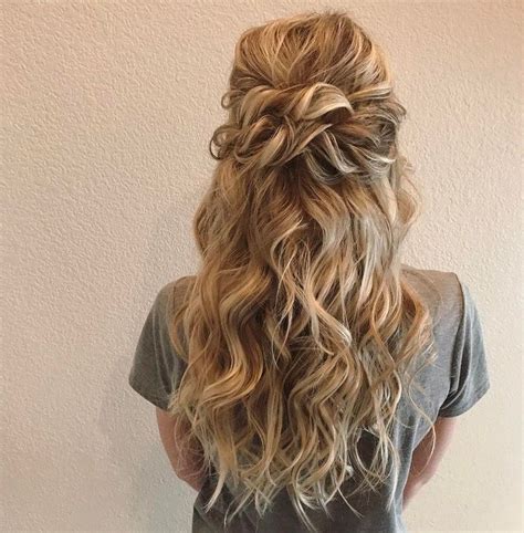 Look cute with minimal effort with this fishtail braid half up half down hairstyle. Beautiful Half Down Half Up Twisted Hairstyle with curls