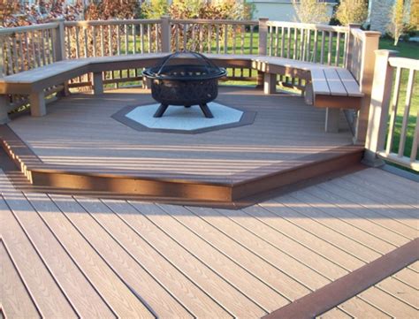 A thermal barrier can prevent high heat from warping composites. Fire pit built into wood deck | Deck design and Ideas