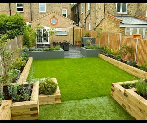 Multi Sized Raised Flower Beds Along The Length Of The Astro Turf And