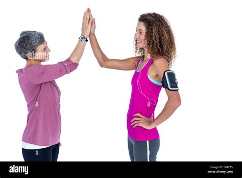 Cheerful Female Friends High Fiving Stock Photo Alamy