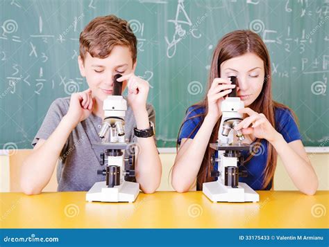 Student In Classroom Using A Microscope Stock Photos Image 33175433