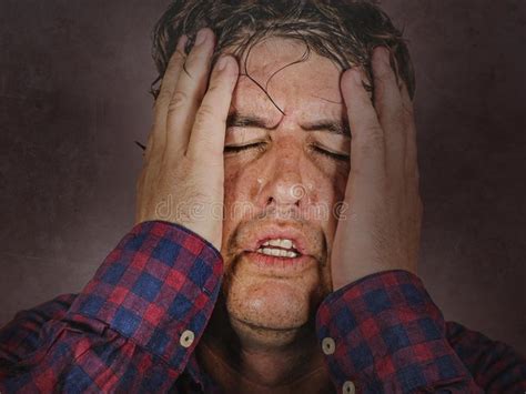 Stressed And Overwhelmed Man Holding Head With Hands In Crazy Stress