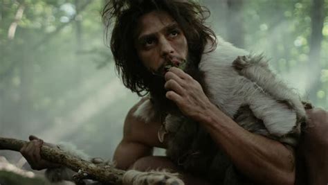 Primeval Caveman Wearing Animal Skin Holds Stone Tipped Spear Looks