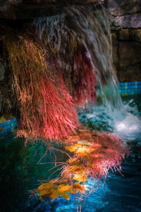 Landscape Of Colorful Flowing Waterfall On Turquoise Water In