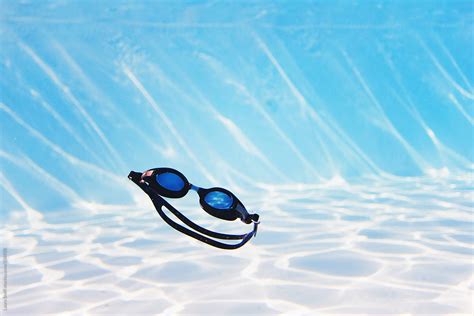 Underwater Shot Of Swim Goggles Floating In Swimming Pool By Laura