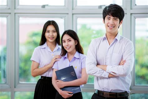 Group Of Asian Student In Thai University Stand In Library Photograph