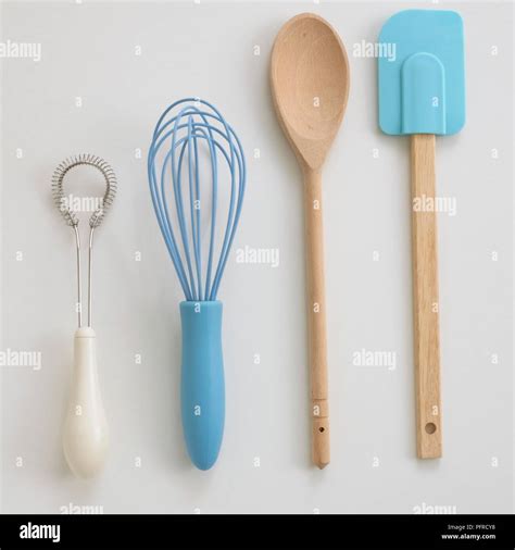 Whisks Wooden Spoon And A Spatula Stock Photo Alamy