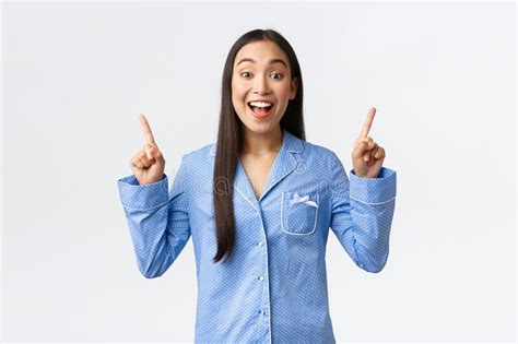 Excited Happy Asian Girl In Blue Pajamas Telling Big News Making