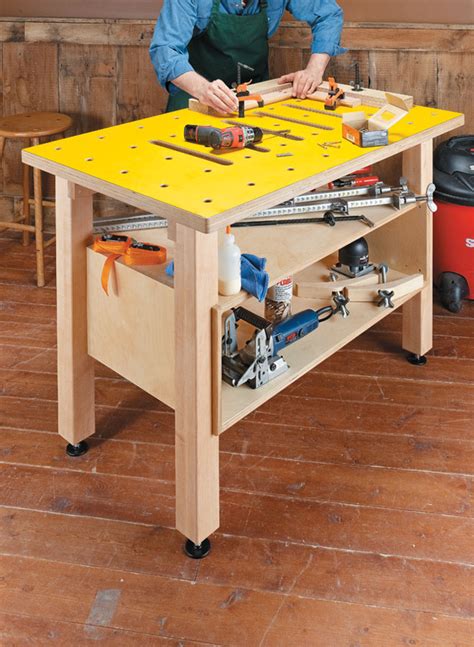 It features an enclosed cabinet for storing accessories and keeping your charcoal dry. Assembly Table | Woodworking Project | Woodsmith Plans
