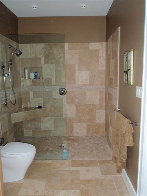 This primary bathroom boasts marble tiles floors and walls, matching the marble sink countertop. Open shower - no door. | Open showers, Showers without ...