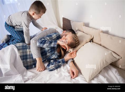 Mom Dad And Son Lie On The Bed At Home Dream Stock Photo Alamy