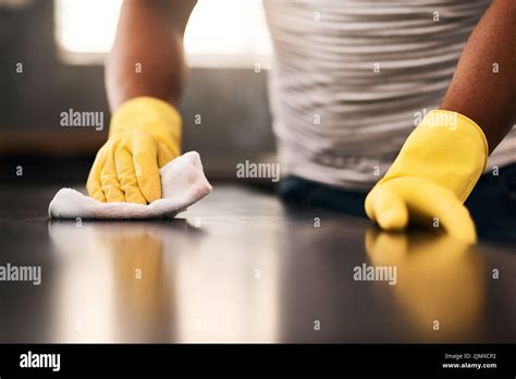 Ill keep wiping until its spotless. an unrecognizable man cleaning a