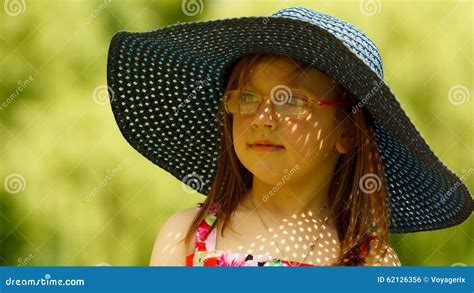 Cute Little Girl In Big Hat Pretending To Be Lady Stock Photo Image