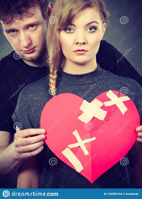 Sad Couple Holds Broken Heart Stock Photo Image Of Grief
