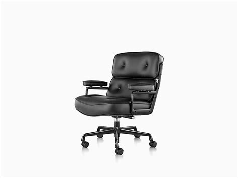 Eames aluminum group chairs, executive chair, soft pad chairs, table universal base, and table segmented base; Eames Executive Chair - Herman Miller