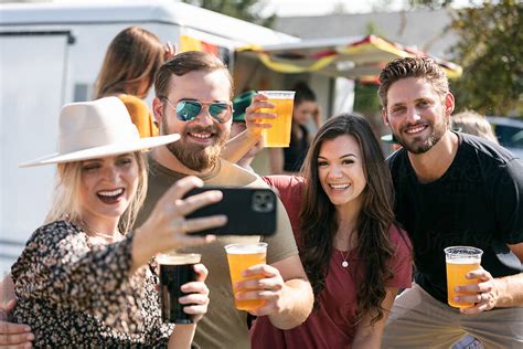 Beer Friends Take Selfie Together By Stocksy Contributor Sean Locke Stocksy