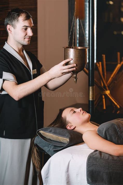 Specialist Making Shirodhara Massage Form Of Ayurveda Therapy Beautiful Woman Spending Time At