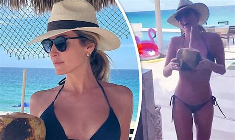Kristin Cavallari Stuns In A Black Bikini While Sipping A Coconut Drink