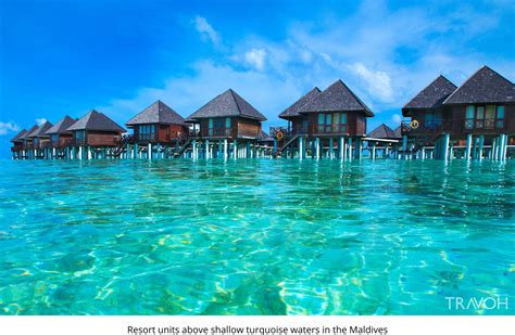 Resort Units Above Shallow Turquoise Waters In The Maldives Travoh