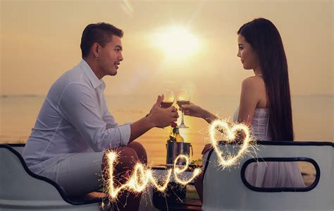 Asian Couple In Romantic Dinner With Sea Beach And Sunset In Thi