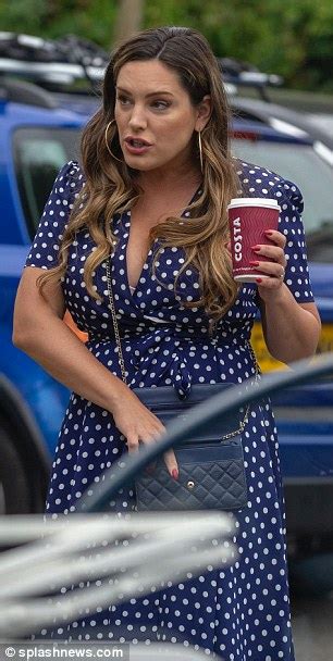 Kelly Brook Digs Down Her Dress And Exposes Her Bra Daily Mail Online