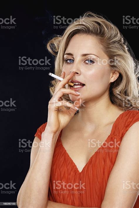 Beautiful Blond Woman Smoking A Cigarette Stock Photo Download Image