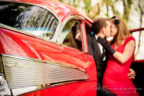 engaged couple kissing in car pre wedding engagement photography session old antique chevy bel