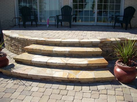 Pavers With Flagstone Steps And A Stacked Stone Wall Flagstone Steps