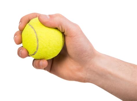 Premium Photo Hand Holding Tennis Ball