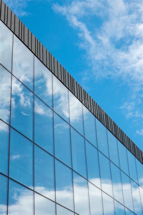 Modern Office Building Exterior With Glass Facade On Clear Sky