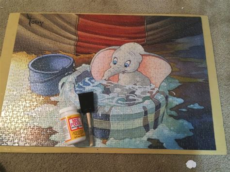 I suggest that you use packing tape that is 2 inches wide or a bit wider. Forever in the Making: How to Frame a Puzzle