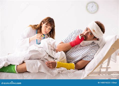 The Young Doctor Examining Injured Patient Stock Image Image Of