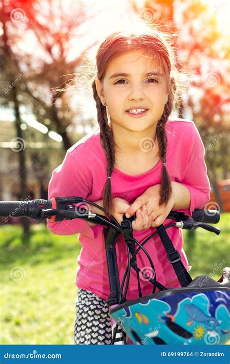 Happy Girl Riding A Bike Stock Photo Image Of Smiling 69199764