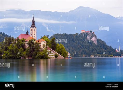 Little Island With Catholic Church And Bled Castle On Bled Lake Stock