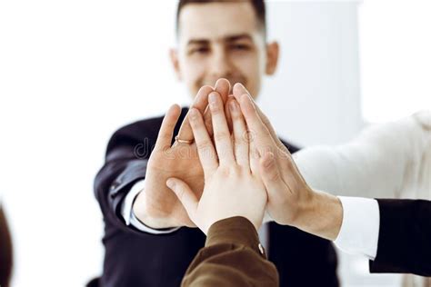 Business People Group Showing Teamwork And Joining Hands Or Giving Five In Modern Office
