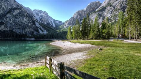 2560x1440 Conifer Fence Lake Landscape Outdoors Nature Photography 5k