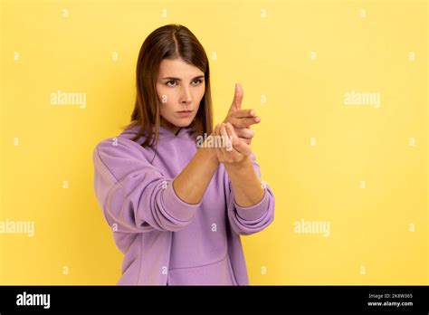 i ll kill you portrait of angry woman pointing finger guns to camera threatening to shoot