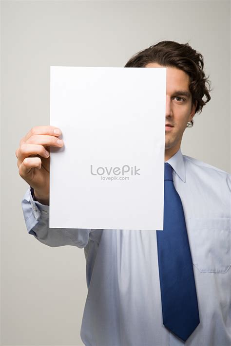 Man Holding A Piece Of Paper Picture And Hd Photos Free Download On Lovepik
