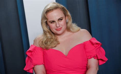 rebel wilson is showing off her figure in a red swimsuit and telling fans that it s never too late