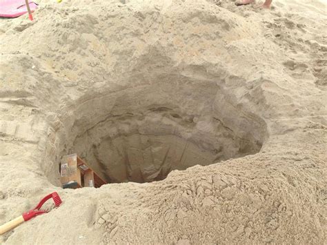 exasperated outer banks town warns people to quit digging giant holes in the beach